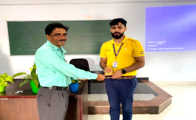 Dr. H Umeshchandra presenting memento to resource person